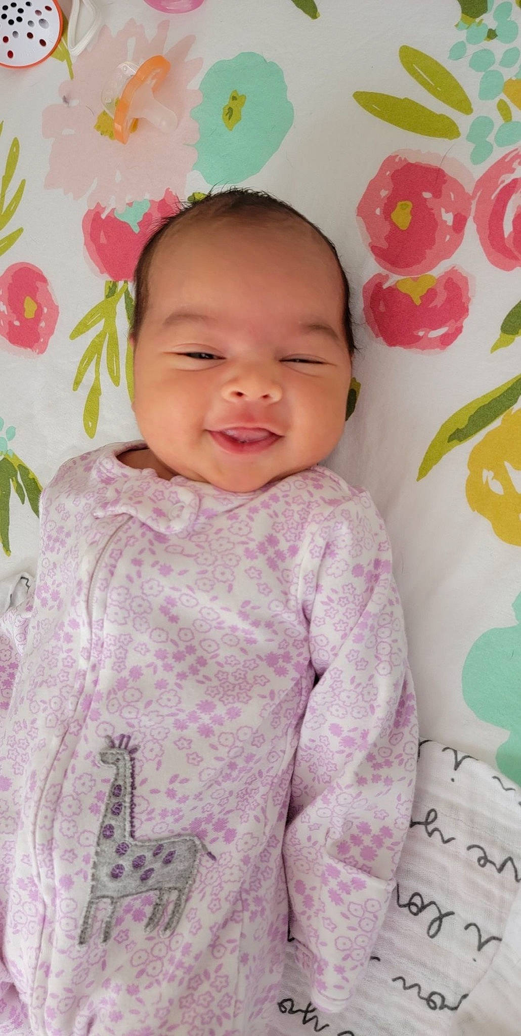 Emy is registered to the contest to win money with this photo: baby, baby_toddler_clothing, beauty, cheek, child, face, facial_expression, hairstyle, happy, linens, lip, magenta, pattern, person, pink, skin, sleeve, smile, textile, toddler