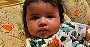 Elizabeth joined the competition — help win amazing prizes! animal_print, baby, baby_seat, child, closeup, colorful, comfortable, cushion, cute, face, hair, indoors, infant, leaf_print, onesie, patterned_clothing, portrait, serious_expression, soft_fabric, young_child