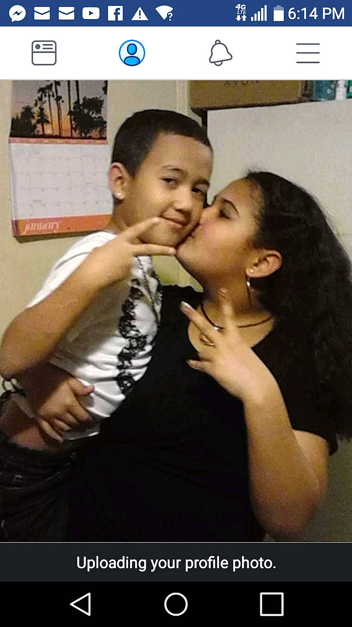 Angel Otero is registered to the contest to win money with this photo: black_hair, cheek, forehead, gesture, interaction, joy, love, person, photo_caption, photography, romance