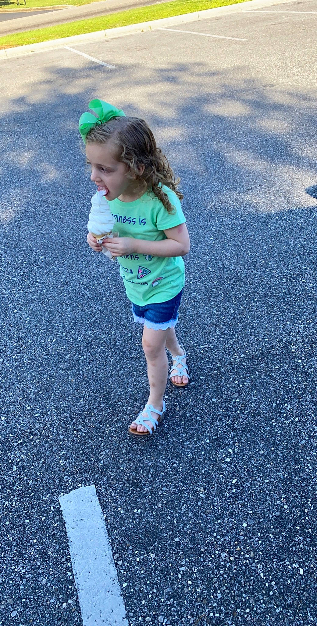 Raelynn is registered to the contest to win money with this photo: asphalt, child, dress, fun, green, people, person, photography, plant, play, recreation, road, road_surface, running, smile, standing, summer, t_shirt, toddler, vacation