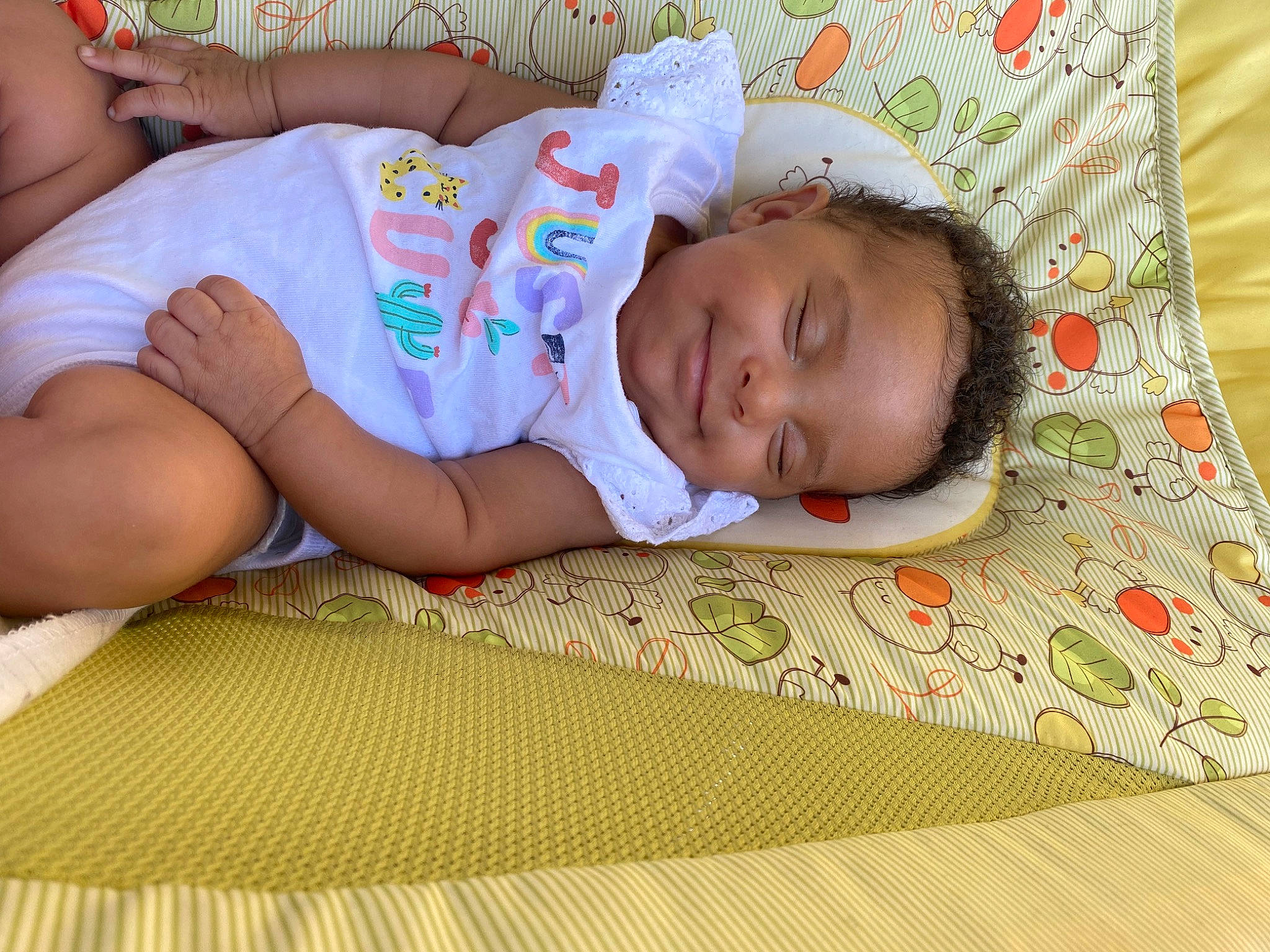 Diara is registered to the contest to win money with this photo: baby, baby_toddler_clothing, bedtime, child, comfort, flooring, grass, happy, human_leg, joy, linens, nap, pattern, person, room, sitting, skin, sleep, t_shirt, thigh