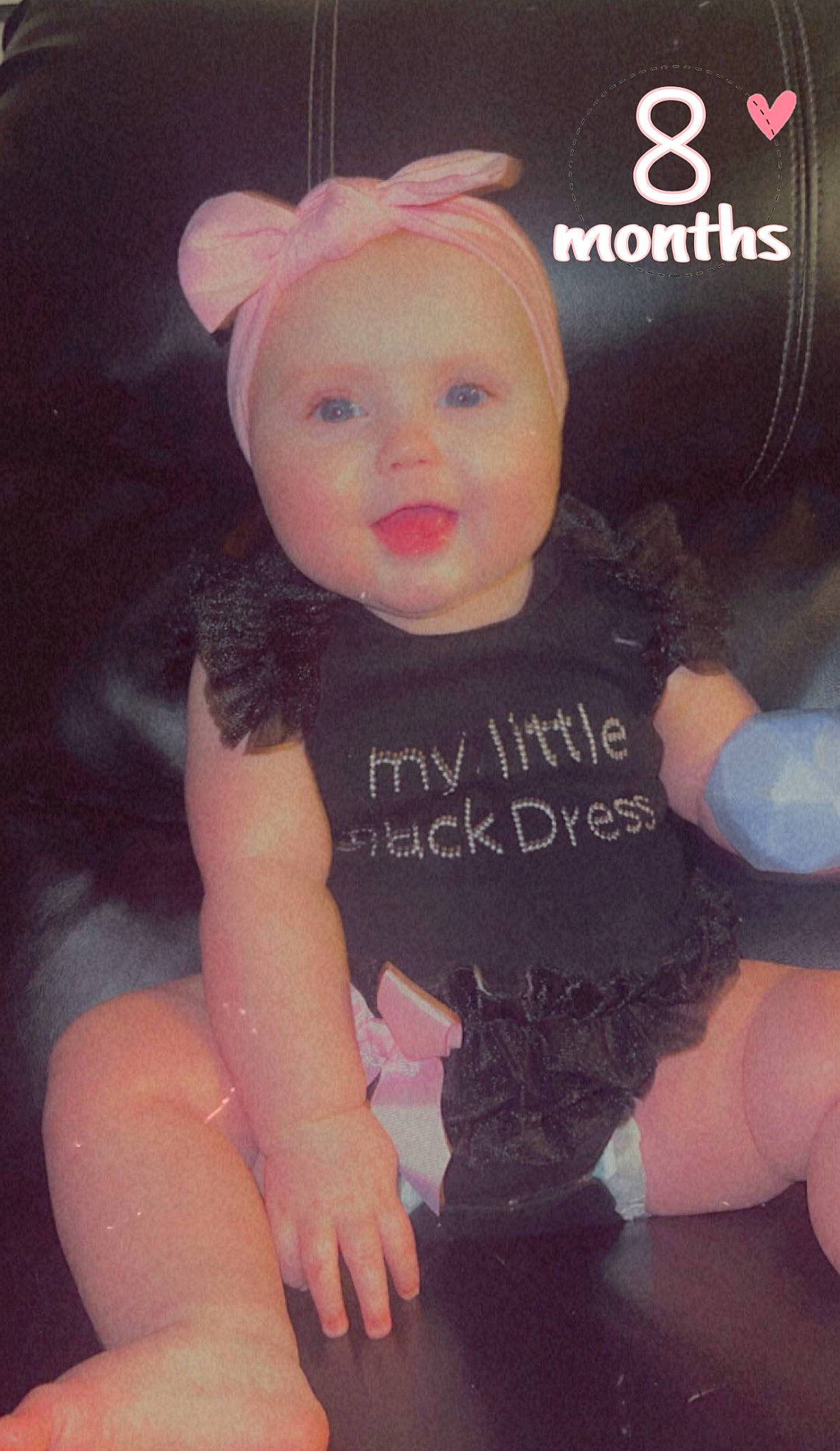 Violet is registered to the contest to win money with this photo: baby, baby_toddler_clothing, cap, cheek, child, cool, finger, font, happy, head, headgear, headwear, magenta, pattern, person, pink, sleeve, smile, t_shirt, thigh