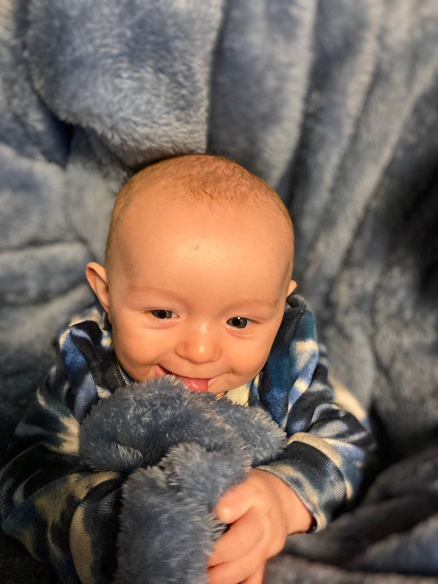 Gustavo is registered to the contest to win money with this photo: baby, cheek, child, eye, fun, fur, gesture, happy, head, nail, nose, person, sitting, skin, stuffed_toy, teddy_bear, thumb, toddler, toy, winter