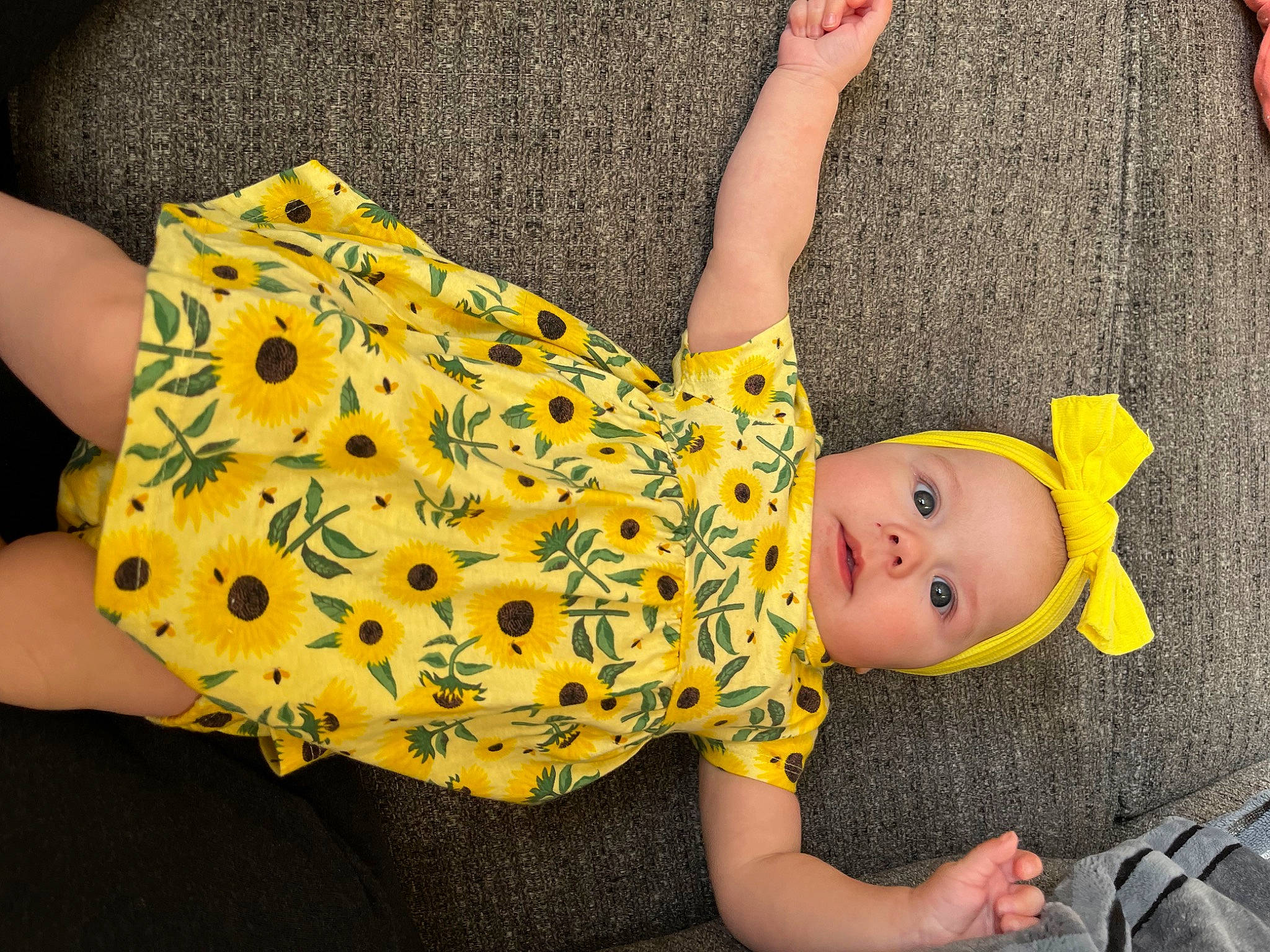 Ahria joined the competition — help win amazing prizes! baby, baby_products, baby_toddler_clothing, child, comfort, dress, foot, fun, happy, headgear, human_body, human_leg, knee, linens, pattern, person, sitting, sleeve, textile, thigh