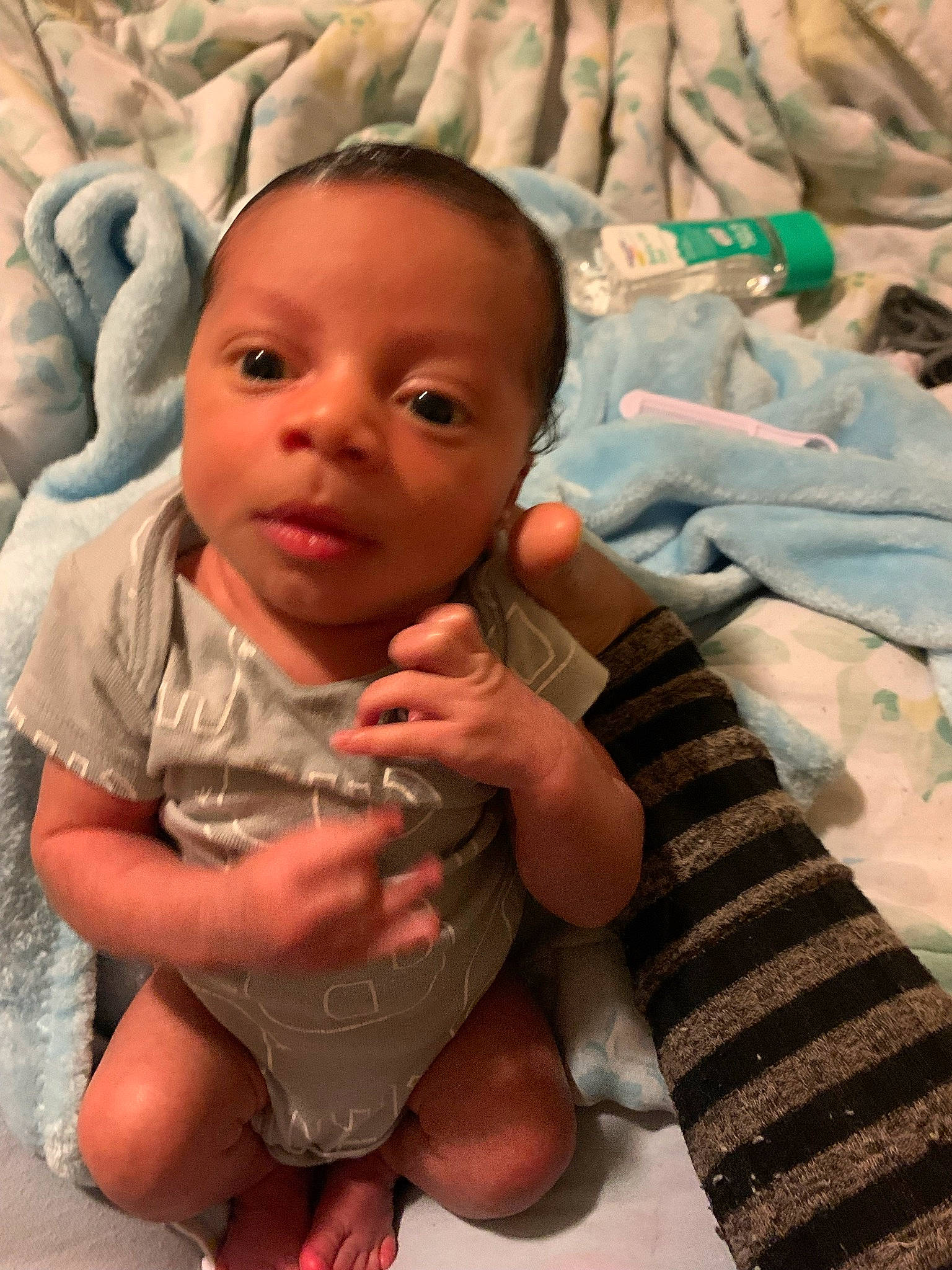 Jesiah is registered to the contest to win money with this photo: baby, baby_toddler_clothing, cheek, finger, gesture, hairstyle, hand, happy, head, human_body, iris, lip, mouth, neck, nose, organ, person, pink, product, skin