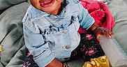 Nevaeh joined the competition — help win amazing prizes! baby, child, smiling, denim_jacket, floral_leggings, yellow_ribbons, socks, bottle, bed, blanket, pillow, indoor, cute, happy, person, headband, bracelet, infant, portrait, toddler
