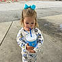 blue_bow, casual, child, clothing, concrete, cup, cute, daylight, drink, footwear, girl, outdoor, pajamas, parking_lot, person, red_posts, sidewalk, store, straw, van