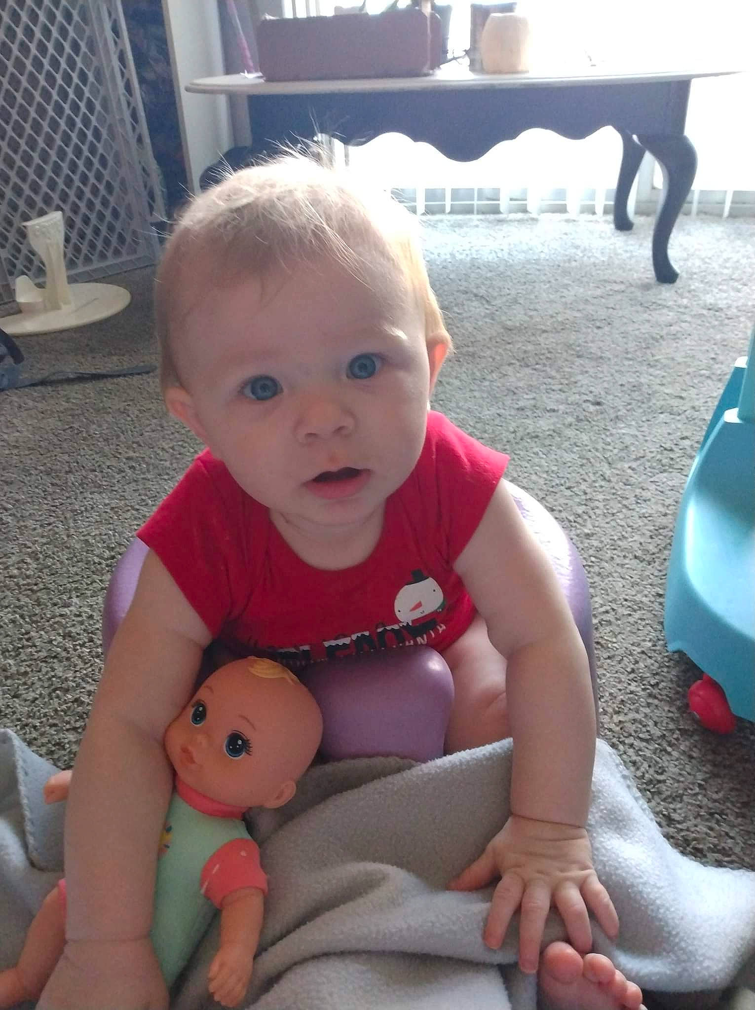 Mavis is registered to the contest to win money with this photo: baby, baby_toddler_clothing, cheek, child, eye, face, finger, floor, flooring, head, human_body, joint, mammal, mouth, person, photograph, skin, standing, toddler, vertebrate