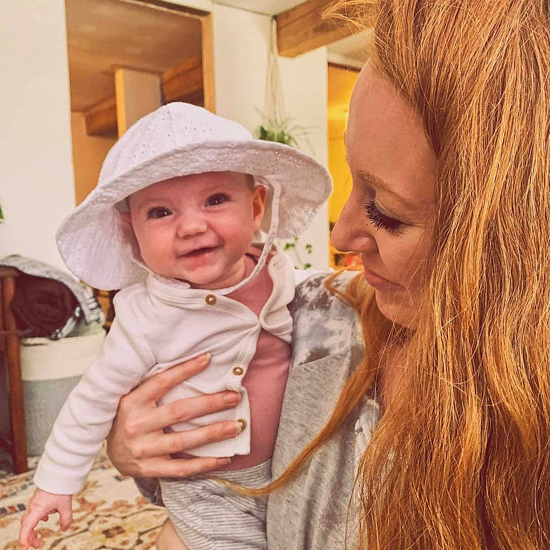 Hollis is registered to the contest to win money with this photo: baby, beard, chair, eye, facial_expression, fun, gesture, hairstyle, happy, hat, head, headgear, headwear, human, iris, joy, lip, mouth, nose, person