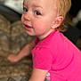 toddler, child, pink_shirt, face, eyes, cheeks, curious, indoor, blanket, pattern, leaning, person, portrait, young_child, skin, hair, candid, expression, close_up, casual