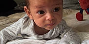 Zemira joined the competition — help win amazing prizes! baby, bed, bedroom, blanket, child, clothing, comfort, curious, cute, expression, face, indoor, infant, plush_toy, portrait, resting, soft_toys, tummy_time, wide_eyes, young_child