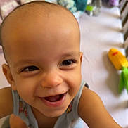 Zemira joined the competition — help win amazing prizes! baby, blanket, child, clothing, colorful, crawling, crib, cute, expression, face, happy, indoors, infant, person, playful, plush, smiling, toddler, toys, young