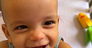 Zemira joined the competition — help win amazing prizes! baby, blanket, child, clothing, colorful, crawling, crib, cute, expression, face, happy, indoors, infant, person, playful, plush, smiling, toddler, toys, young