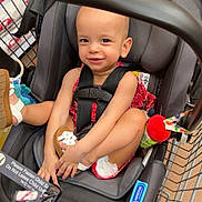 Zemira joined the competition — help win amazing prizes! baby, car_seat, child, child_seat, cute, footwear, grocery_store, happy, indoor, infant, person, red_outfit, safety, seat, shopping_cart, smiling, straps, supermarket, toddler, toy