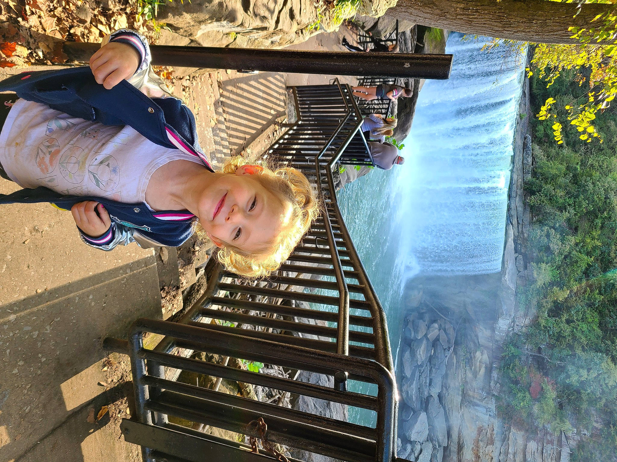 Kinleigh is registered to the contest to win money with this photo: child, fun, happy, hat, joy, landscape, leisure, light, people, person, plant, public_space, recreation, sitting, smile, stairs, toddler, track, travel, tree
