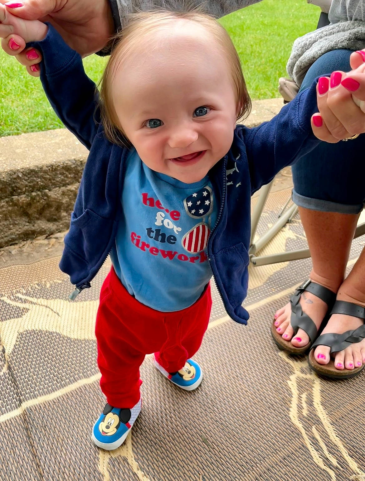 Lane is registered to the contest to win money with this photo: baby, baby_toddler_clothing, child, cool, electric_blue, flooring, footwear, fun, grass, happy, leisure, person, plant, recreation, shoe, sleeve, smile, snapshot, sneakers, t_shirt