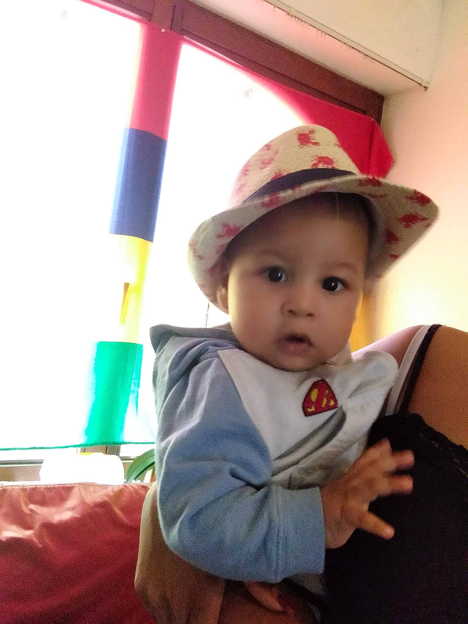 Nolan participe au concours pour gagner de l'argent avec cette photo : baby, baby_products, baby_toddler_clothing, cap, child, chin, costume_hat, fashion_accessory, fun, happy, hat, headgear, leisure, lip, person, skin, standing, sun_hat, toddler, travel