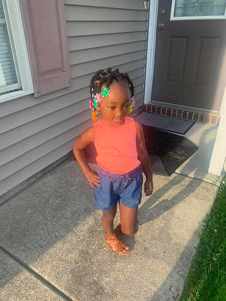 Braxtyn is registered to the contest to win money with this photo: asphalt, baby_toddler_clothing, door, electric_blue, floor, flooring, fun, grass, human_leg, leisure, person, plant, shorts, standing, t_shirt, thigh, toddler, waist, window, window_blind