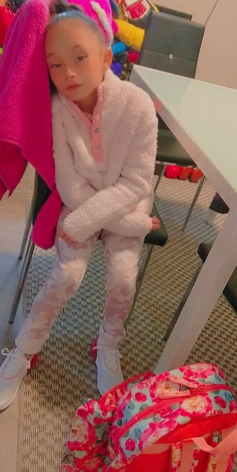 Giana is registered to the contest to win money with this photo: carmine, costume, eyewear, fashion_accessory, fashion_design, flooring, foot, fur, fur_clothing, human_leg, knee, magenta, pattern, person, pink, red, sitting, sportswear, sunglasses, textile