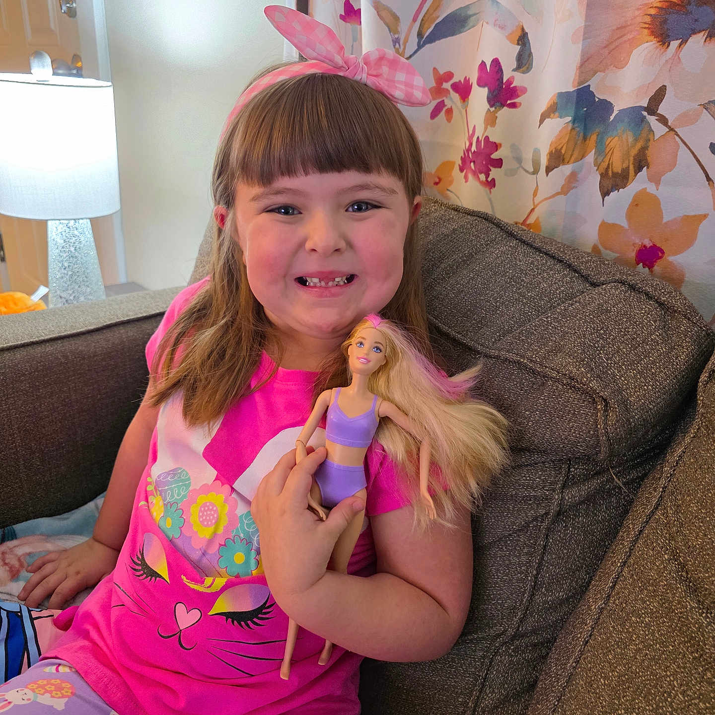 Liliana is registered to the contest to win money with this photo: architecture, bodypart, building, child, clothing, couch, cushion, face, female, furniture, girl, hat, head, homedecor, indoors, livingroom, person, photography, portrait, room