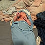 Zachary joined the competition — help win amazing prizes! baby, newborn, infant, wrapped_in_towel, blue_towel, hooded_towel, blanket, bed, soft_texture, jeans, sock, remote_control, lying_down, sleepy, tiny_hands, portrait, indoor, cozy, skin, clothing