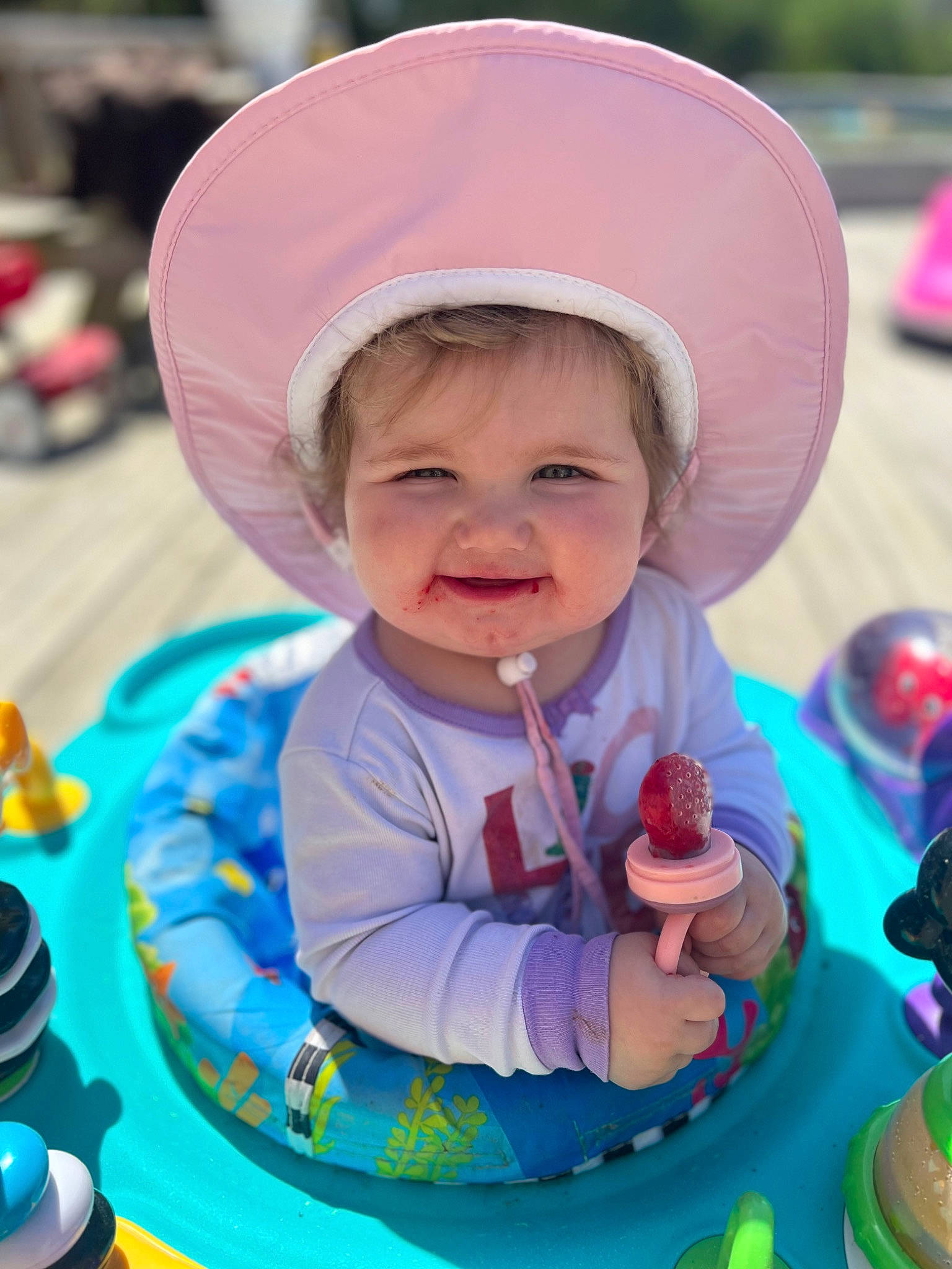 Paisleigh joined the competition — help win amazing prizes! baby, baby_toddler_clothing, cake, cake_decorating, cap, child, clothing, face, facial_expression, fun, green, happy, hat, leisure, person, pink, skin, smile, sugar_cake, sun_hat