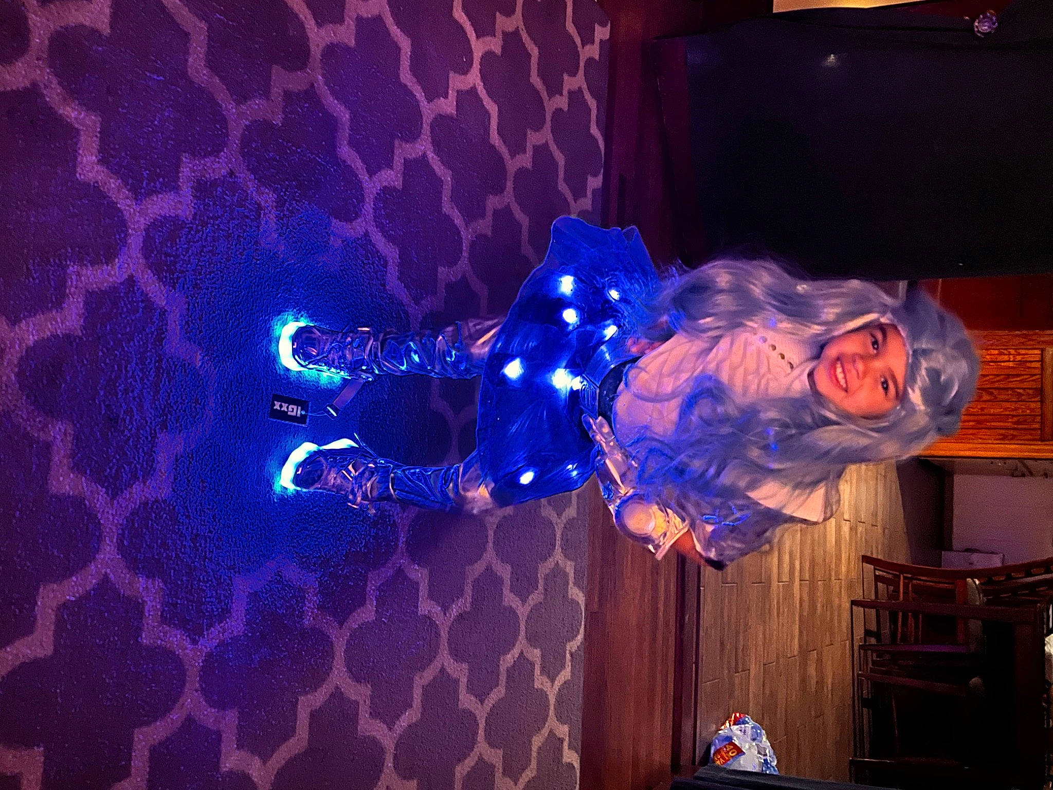 Amilya is registered to the contest to win money with this photo: art, electric_blue, entertainment, event, fun, headwear, joy, magenta, night, performance, performance_art, performing_arts, person, plant, public_event, purple, smile, space, tree, violet