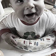 Wyatt is registered to the contest to win money with this photo: baby, caterpillar, child, closeup, clothing, colorful, cute, expression, face, fun, hand, happy, indoor, infant, piano, play, seat, smile, table, toy