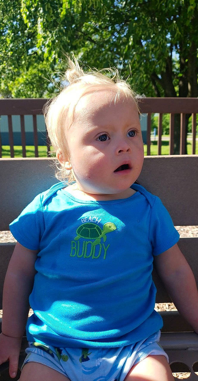 Ray is registered to the contest to win money with this photo: baby, baby_toddler_clothing, blond, blue, cheek, child, eye, face, person, play, skin, smile, summer, surprise, t_shirt, toddler, vacation
