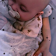 Keyden participe au concours pour gagner de l'argent avec cette photo : baby, sleeping, pacifier, blanket, cozy, child, cute, infant, soft, comfort, warm, hand, pajamas, face, closeup, peaceful, rest, indoors, relax, cuddle