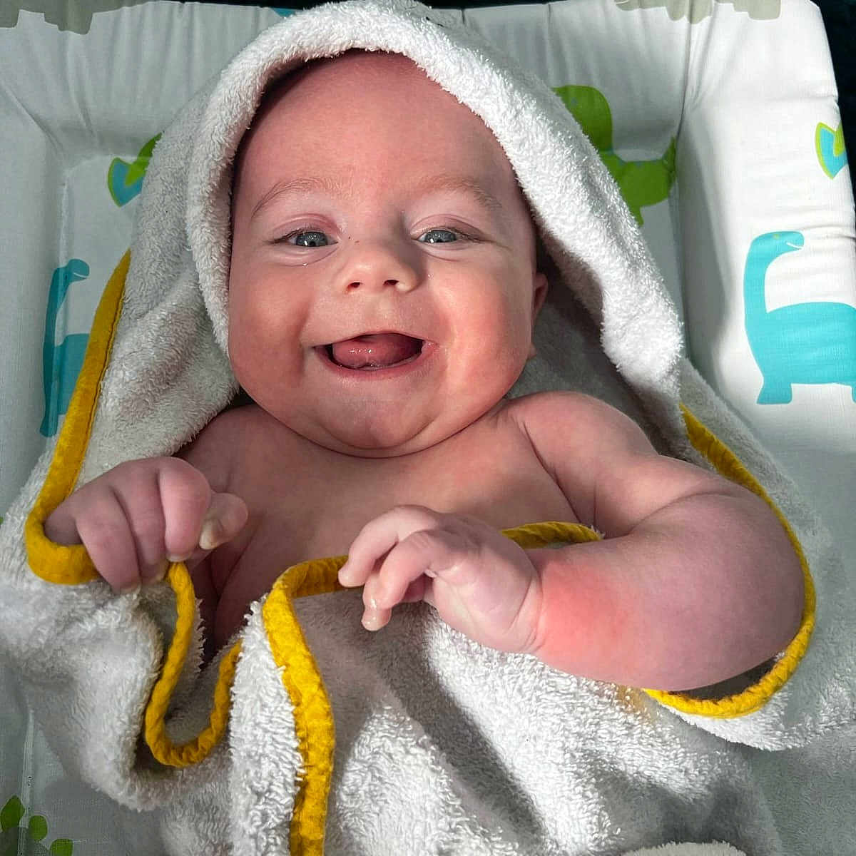 Cee-Jay joined the competition — help win amazing prizes! baby, blanket, child, chubby_cheeks, cute, expression, face, hand, happy, head, indoors, infant, newborn, playful, portrait, skin, smiling, towel, wrapping, young