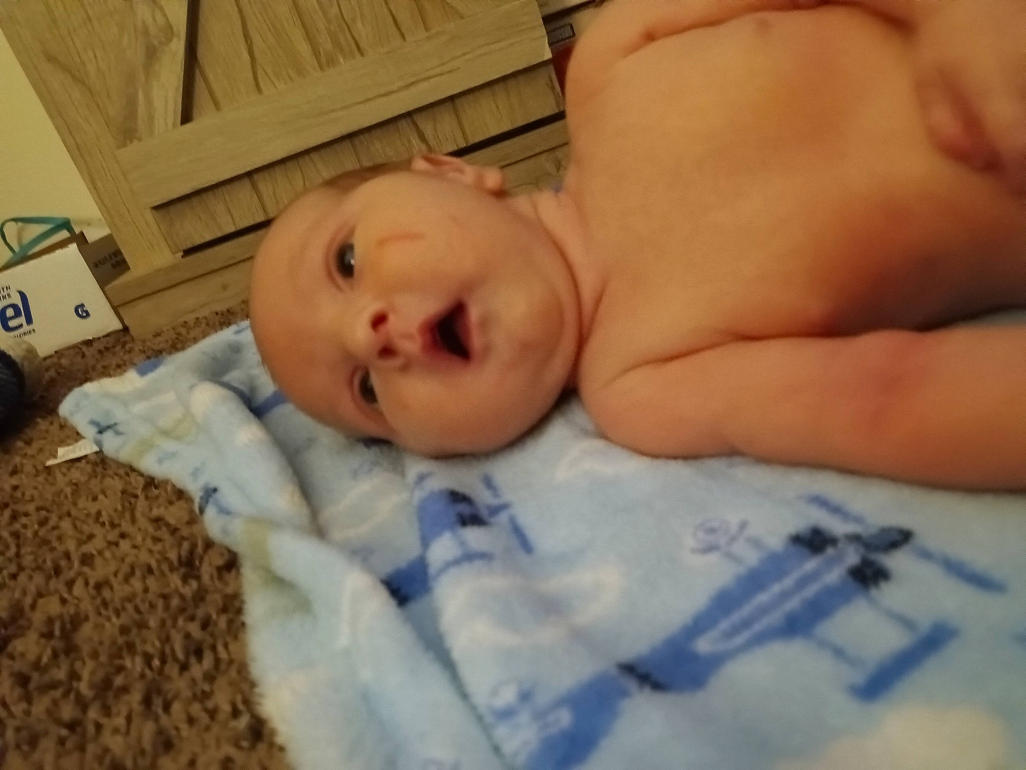 Charles is registered to the contest to win money with this photo: abdomen, baby, baby_products, baby_sleeping, baby_toddler_clothing, bedding, bedtime, box, carton, cheek, child, comfort, linens, nap, person, room, shipping_box, sleep, toddler, wood
