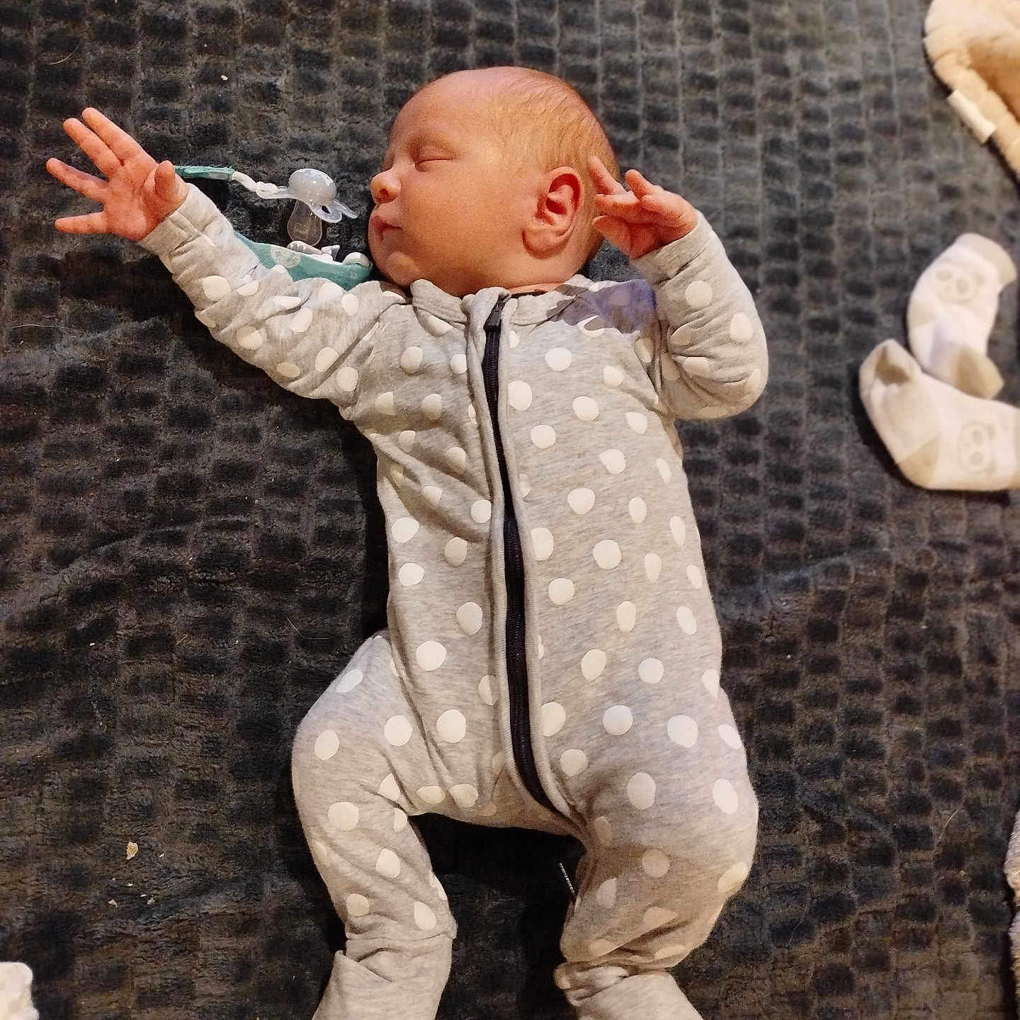 Aaron participe au concours pour gagner de l'argent avec cette photo : baby, bed, bedroom, bodypart, clothing, coat, couch, face, finger, furniture, hand, head, jacket, newborn, pajamas, pants, person, photography, portrait, sleeping