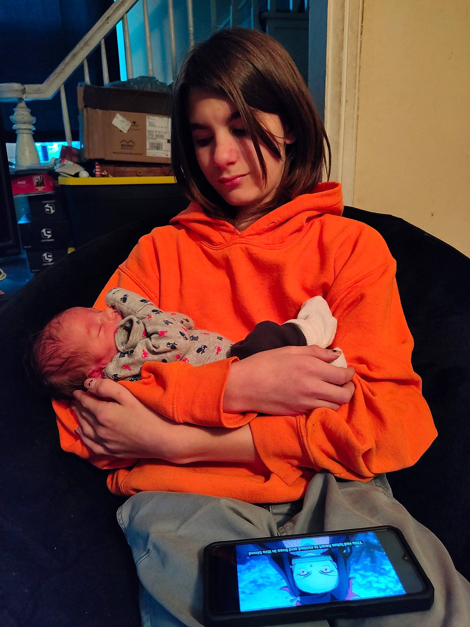 Killian joined the competition — help win amazing prizes! baby, child, comfort, communication_device, electric_blue, event, fun, gadget, lap, mobile_device, mobile_phone, muscle, musical_instrument, orange, person, personal_protective_equipment, portable_communications_device, room, sitting, tablet_computer