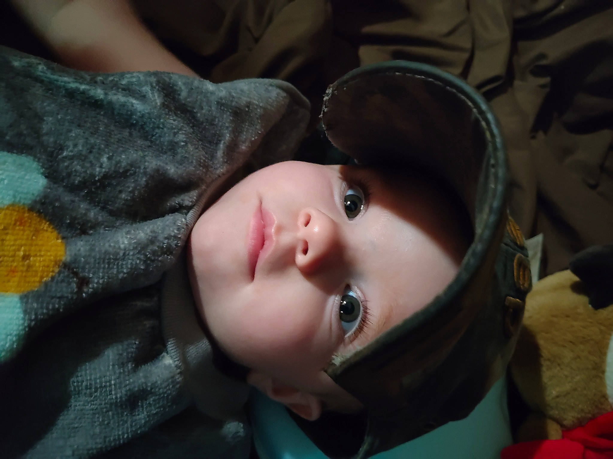 Killian is registered to the contest to win money with this photo: baby, black_hair, cheek, child, eyelash, fashion_accessory, flash_photography, fun, fur, grass, lip, nose, person, portrait, portrait_photography, smile, toddler, tree, wood