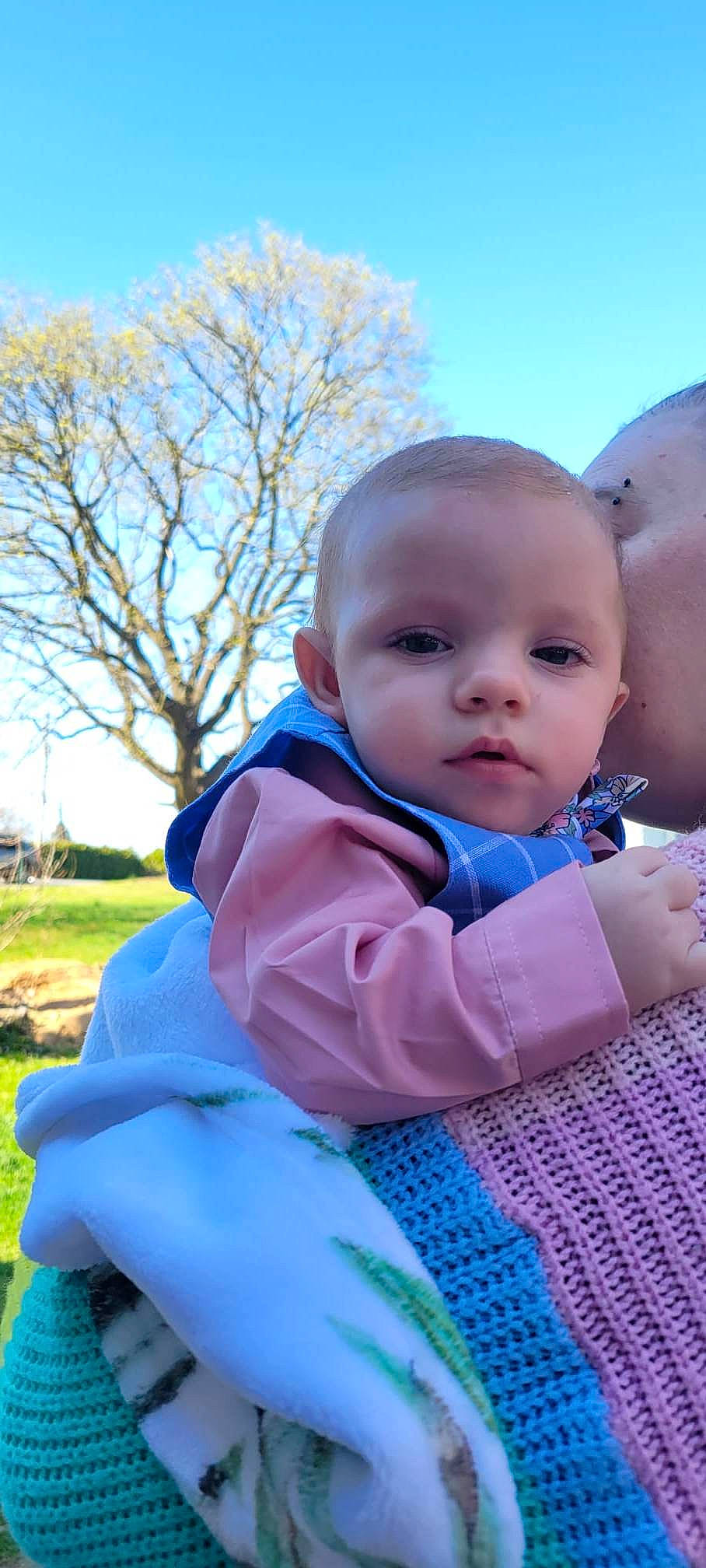 Killian joined the competition — help win amazing prizes! baby, baby_products, baby_toddler_clothing, cheek, child, electric_blue, face, fun, grass, happy, leisure, outerwear, people_in_nature, person, plant, recreation, sitting, skin, sky, toddler