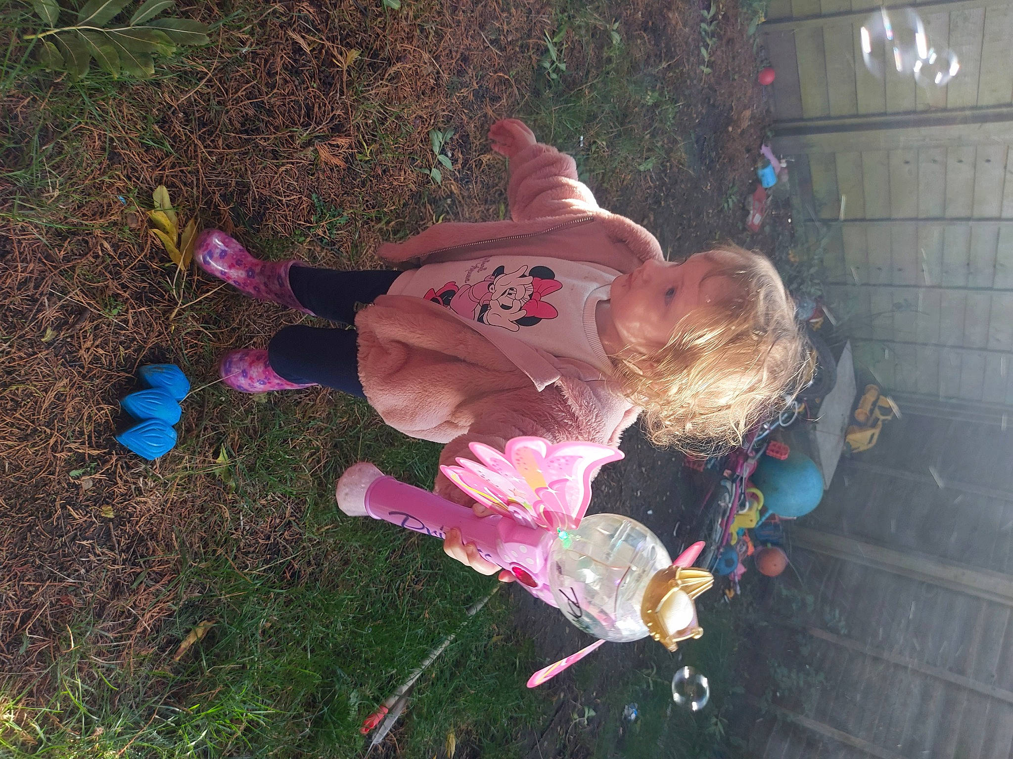 Davina is registered to the contest to win money with this photo: baby, child, fun, grass, happy, magenta, people_in_nature, person, petal, pink, plant, soil, toddler