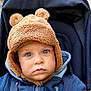 Robin a rejoint le concours — aidez-le/la à gagner de superbes lots ! baby, baby_clothing, bear_ears, blue_eyes, child, child_in_stroller, closeup, cute, expression, face, fuzzy_hat, hat, infant, jacket, looking_at_camera, outdoor, portrait, stroller, warm, winter_clothing