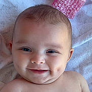 Calliope joined the competition — help win amazing prizes! baby, smile, dimples, face, head, eyes, skin, blanket, pink, knitted, soft, cozy, infant, child, portrait, lying_down, happy, cute, person, closeup