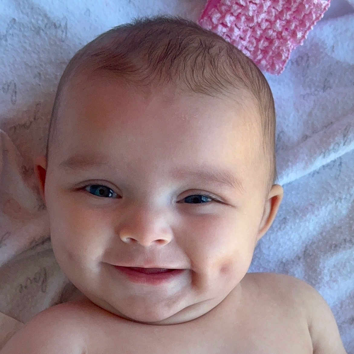 Calliope joined the competition — help win amazing prizes! baby, blanket, child, closeup, cozy, cute, dimples, eyes, face, happy, head, infant, knitted, lying_down, person, pink, portrait, skin, smile, soft