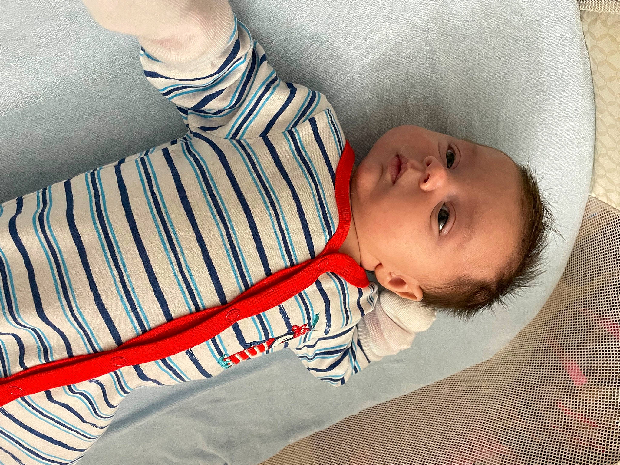 Camden is registered to the contest to win money with this photo: baby, baby_products, baby_safety, baby_sleeping, baby_toddler_clothing, child, comfort, elbow, electric_blue, gesture, human_leg, linens, nail, pattern, person, skin, sleeve, textile, thigh, toddler