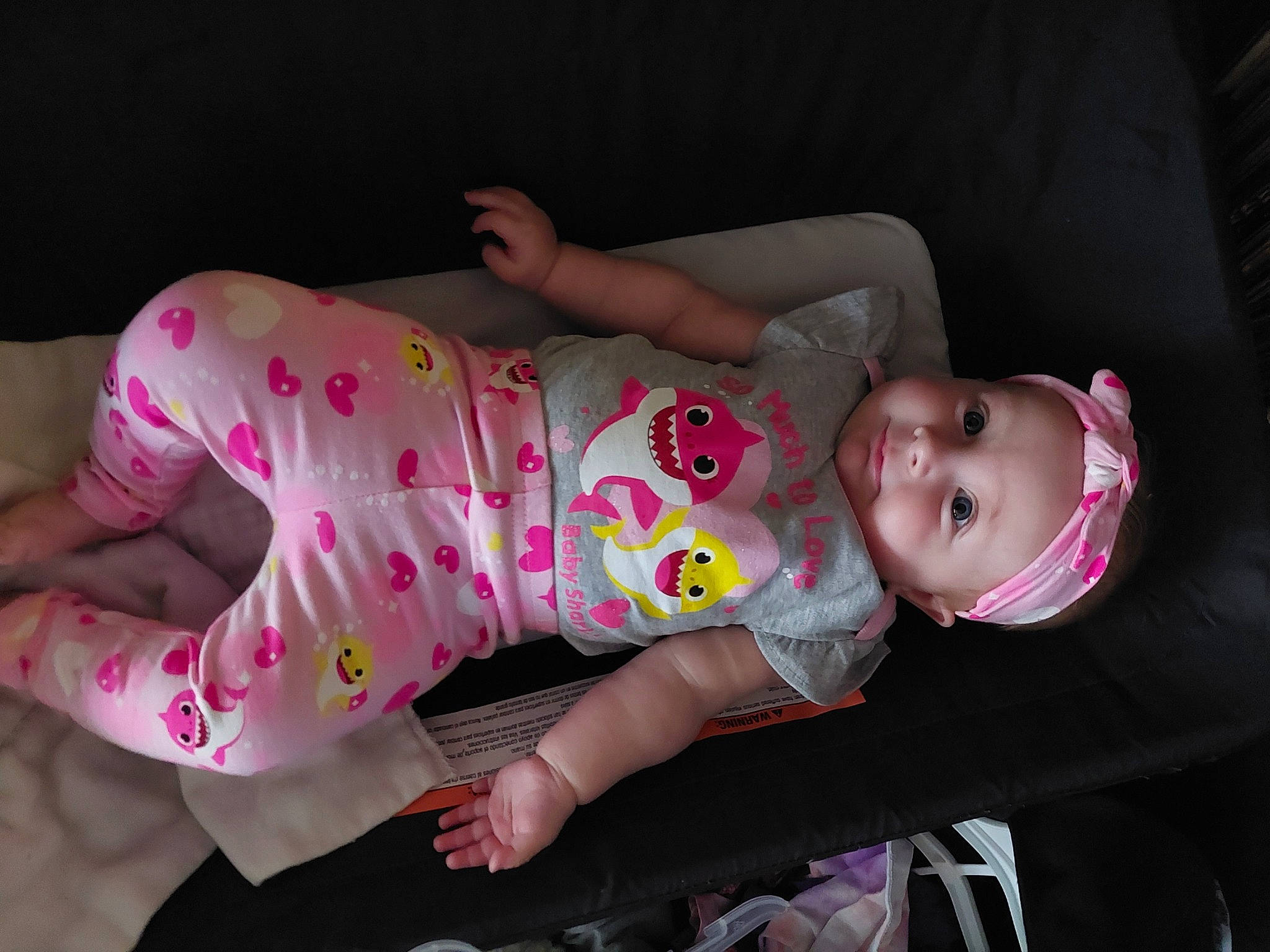 Eliana is registered to the contest to win money with this photo: baby, baby_products, baby_toddler_clothing, cheek, child, comfort, foot, fun, headwear, human_body, linens, magenta, mouth, nightwear, pattern, person, pink, sitting, skin, sleeve