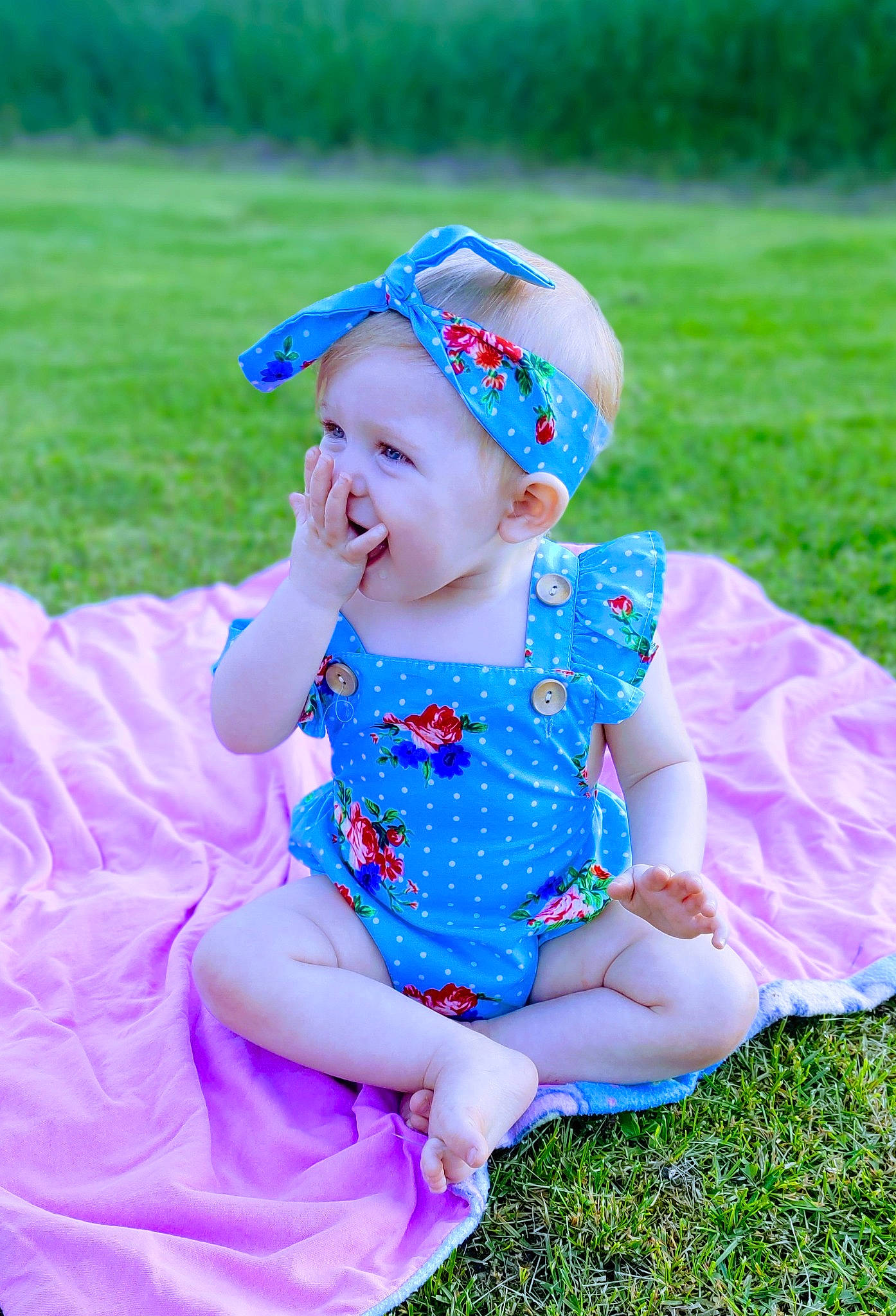 Saphirah is registered to the contest to win money with this photo: baby, baby_toddler_clothing, cap, electric_blue, fun, grass, grass_family, happy, hat, headband, headwear, magenta, pattern, people_in_nature, person, pink, plant, purple, recreation, smile