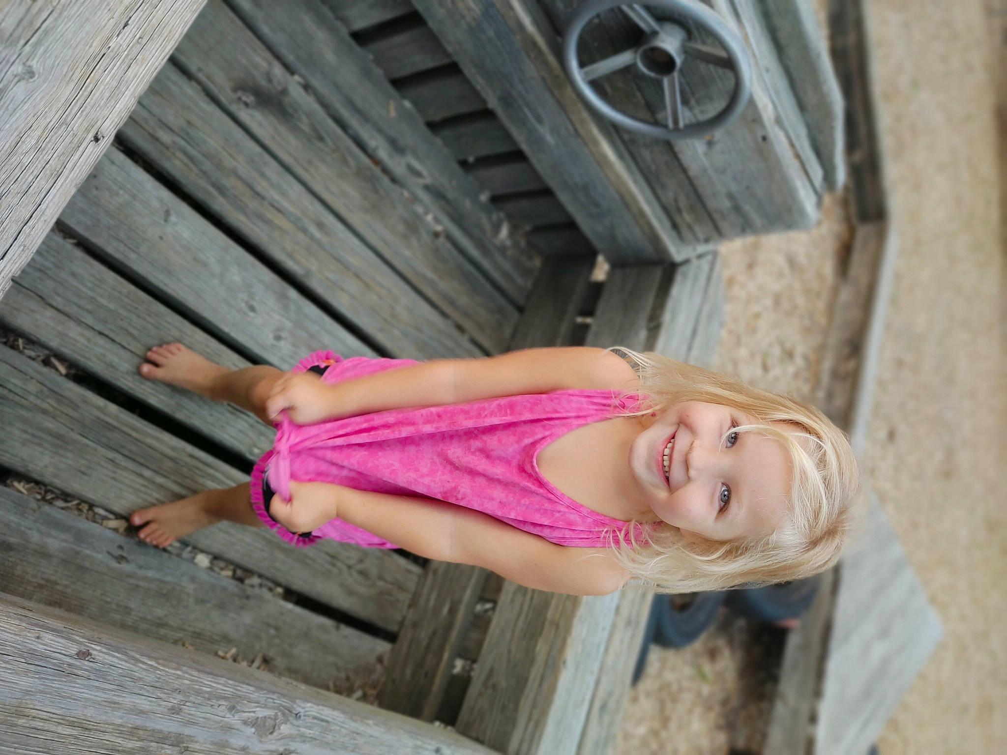 Ezriah is registered to the contest to win money with this photo: abdomen, dress, eyewear, face, hair, happy, hardwood, hat, head, human_leg, joy, leisure, long_hair, magenta, person, pink, smile, street_fashion, thigh, trunk