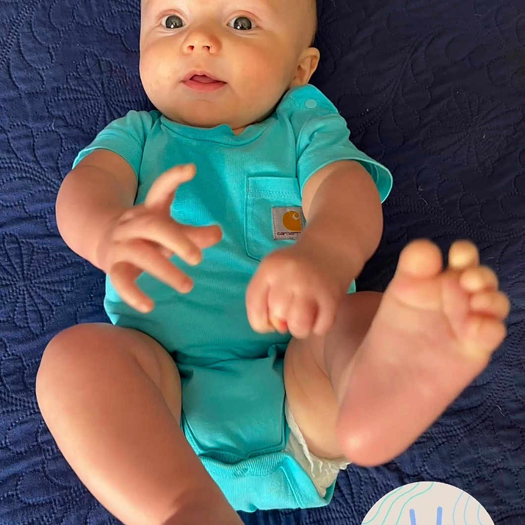 Jacob is registered to the contest to win money with this photo: arm, baby, babylaughing, bodypart, clothing, face, happy, head, heel, person, photography, portrait, sitting, sleeve