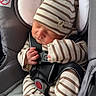 Orhan is registered to the contest to win money with this photo: newborn, baby, sleeping, striped_clothing, hat, car_seat, safety_harness, infant, child, cute, cozy, soft_light, indoors, peaceful, tiny_hands, striped_hat, comfort, resting, portrait, seat
