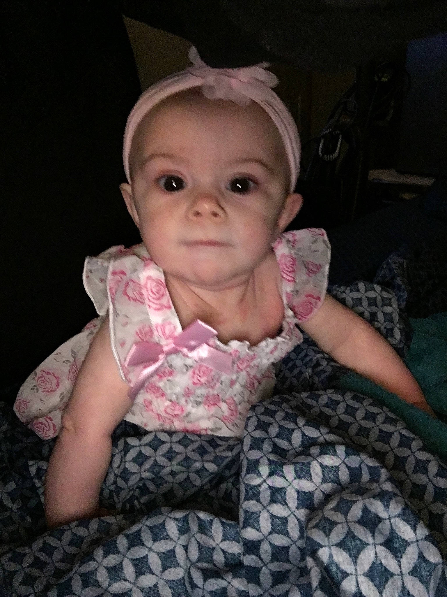 Miracle is registered to the contest to win money with this photo: baby, cheek, child, dress, ear, eye, face, fun, head, person, pink, sitting, skin, smile, toddler