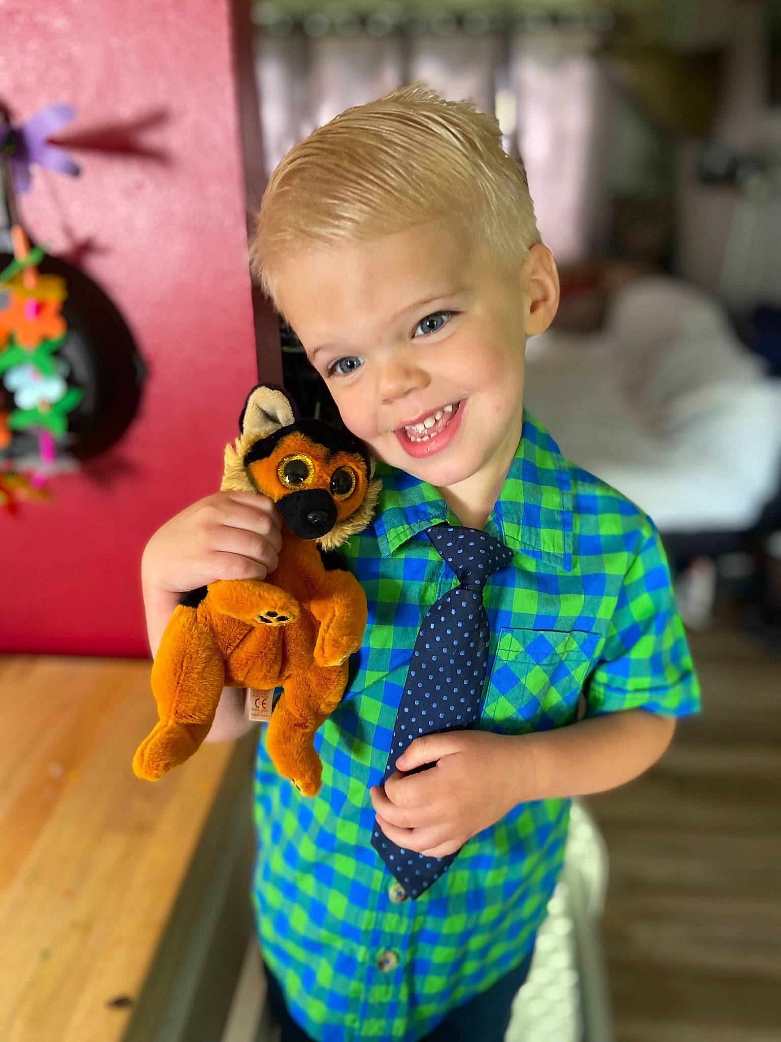 Wyatt is registered to the contest to win money with this photo: baby, baby_toddler_clothing, child, doll, fawn, fun, happy, insect, joy, orange, pattern, person, plaid, pollinator, sleeve, smile, standing, tartan, textile, toddler
