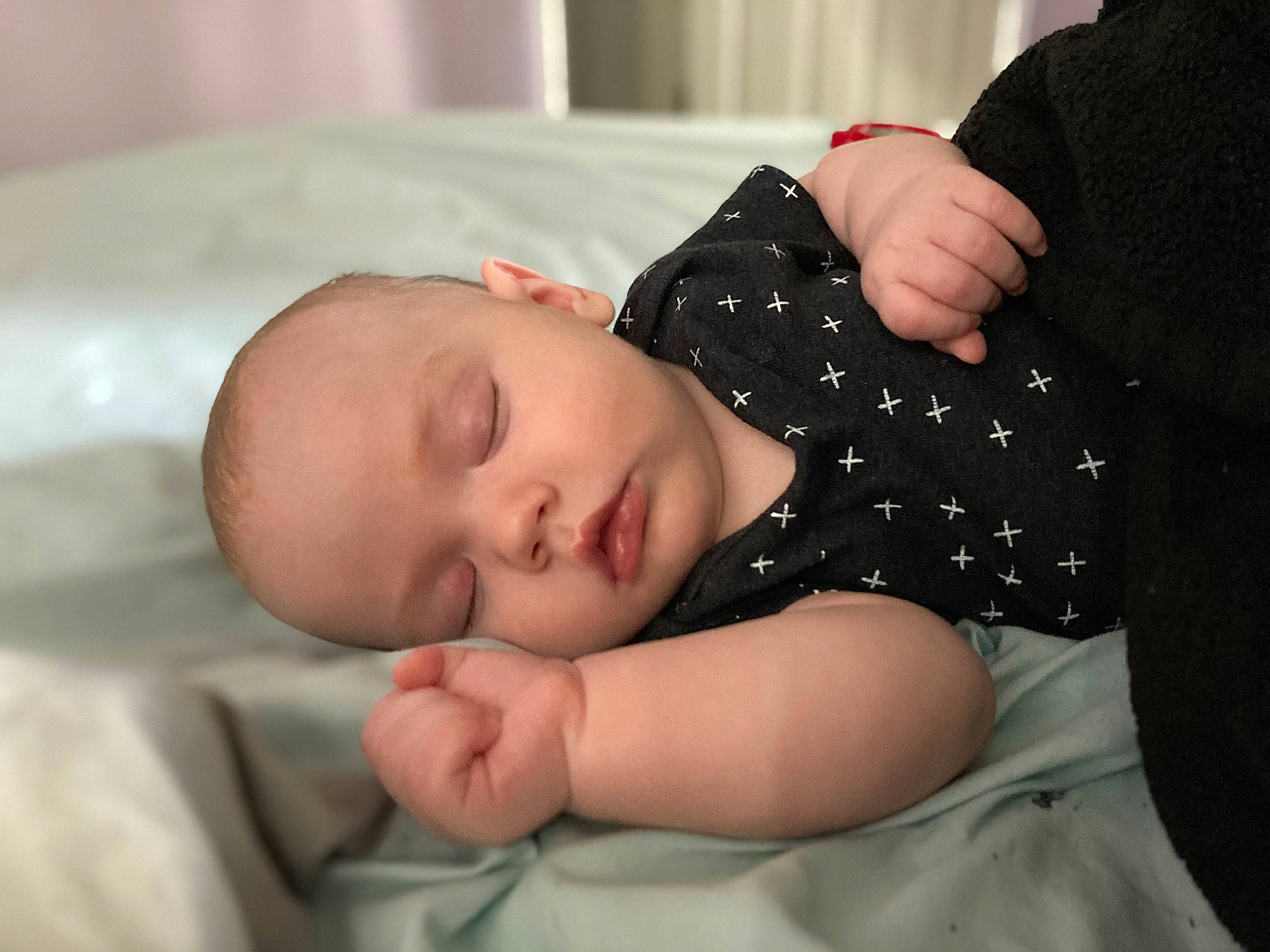 Lennon is registered to the contest to win money with this photo: arm, baby, baby_sleeping, baby_toddler_clothing, bedtime, cheek, child, comfort, elbow, eye, gesture, hand, linens, pattern, person, portrait_photography, room, sleep, sleeve, textile