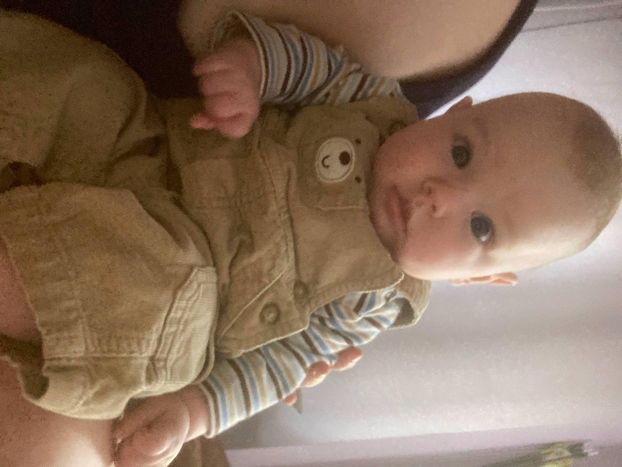 Lennon is registered to the contest to win money with this photo: baby, baby_toddler_clothing, cheek, child, chin, comfort, ear, eye, eyebrow, gesture, head, human_body, iris, lip, mouth, neck, nose, person, skin, sleeve